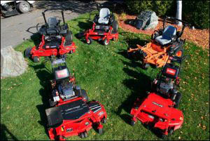 Six Riding Lawn Mowers Setup Outside